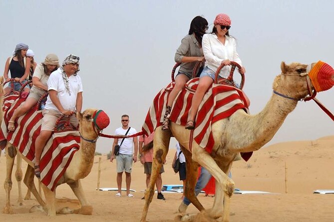 1-Hour Dune Buggy Self Drive with Camel Ride and Sand Boarding in Red Dunes - Water, photos, and the small service details