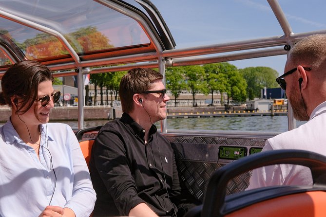 Amsterdam 1h Canal Cruise by Semi-Open Boat with Audio Guide - Magere Brug, Munt Tower, and the Singel