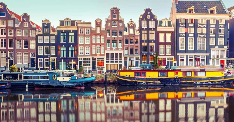 Amsterdam Audioguide - TravelMate app for your smartphone - Amsterdam’s canals, port, and city setting