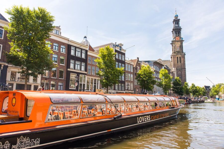 Amsterdam: City Centre Canal Cruise including Audioguide - Audio commentary, captain stories, and the feel on board