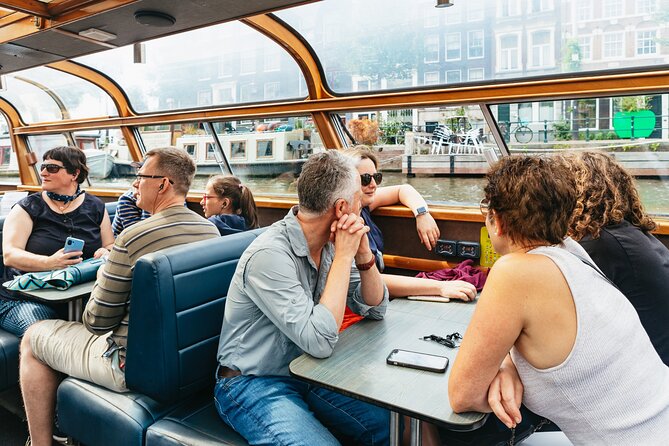 Amsterdam City Centre Cruise on heated boat with Audioguide - Heated comfort, photographs, and the weather