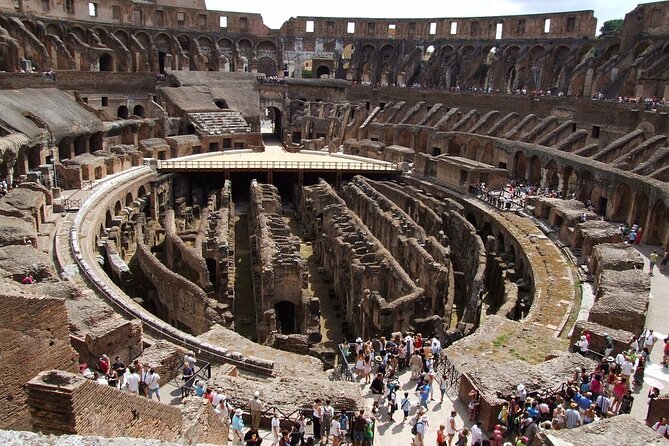 Colosseum, Forum, Palatine Hill with audio guide and Arena or Bus option - Walking through the Roman Forum