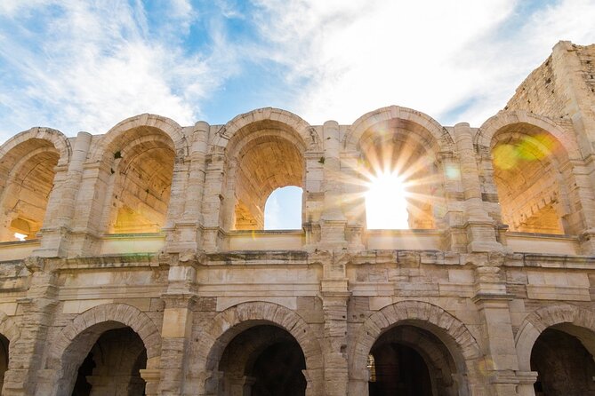 Colosseum with Digital Audioguide and Arena Option - Walking through the Roman Forum