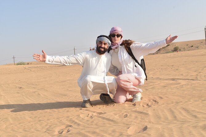 Dubai: 60Minute Self-Drive ATV Quadbike, Camel Ride, Sand Surfing - Pickup makes this easier to fit into a Dubai visit
