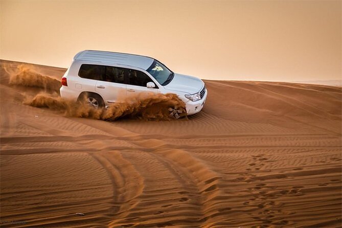 Dubai Desert Safari with Self Drive Quad Biking & Camel Riding - Sandboarding and sunset photo time