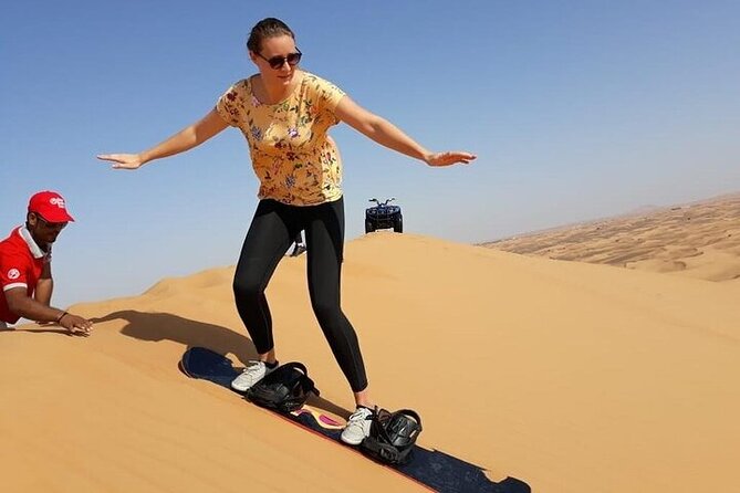 Dubai Self-drive Quad Bike, Sand Boarding, Camels & Refreshments - Sandboarding Adds a Short Burst of Fun