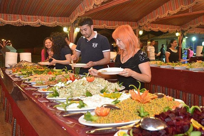 Evening Desert Safari with BBQ Dinner & self-drive Quad biking - The camel ride is brief but gives you a traditional touch