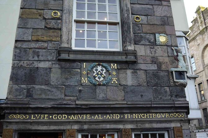 Highlights from the Royal Mile: A Self-Guided Audio Tour - Mercat Cross and the hard edge of public justice