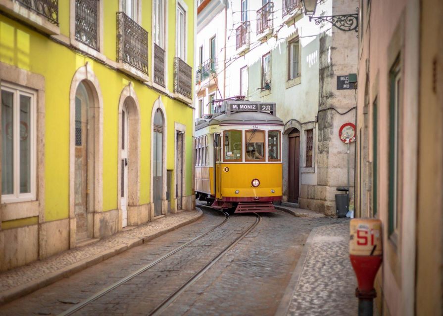 Lisbon: Tram 28 Entry Ticket & Audio Guide with 24-Hour Pass - Alfama from a moving tram