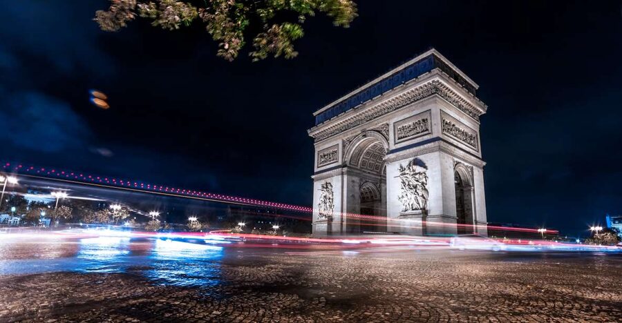 Paris: Panoramic Night Tour with Audio Guide and Host - Paris after dark from an open-top coach