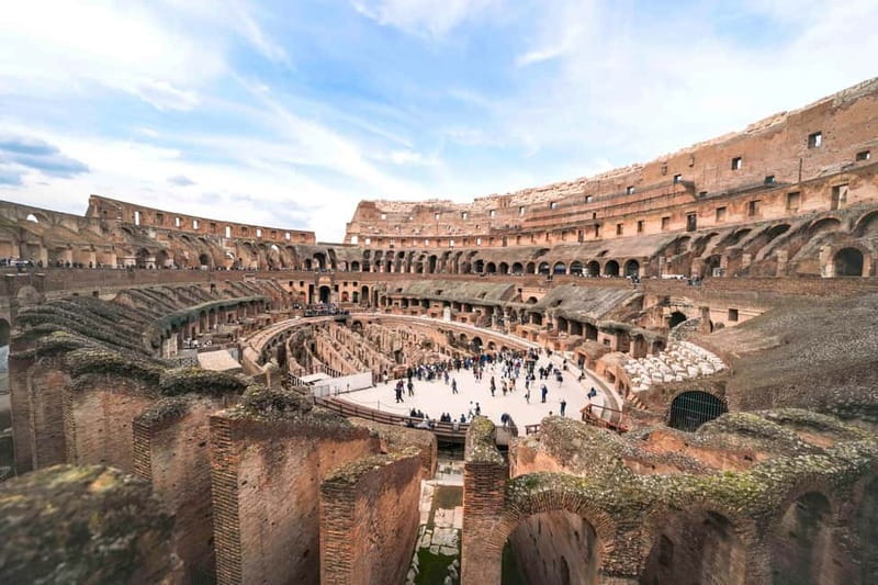 Rome: Colosseum, Forum, Palatine Hill Entry, and Audio Guide - Entering the Colosseum and finding the arena floor