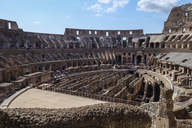 Rome: Colosseum, Forum, & Palatine Hill with Audio Guide - Entering the Colosseum with an audio guide