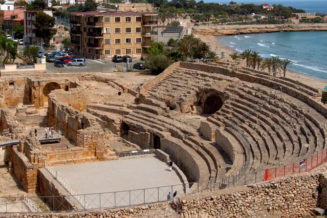 Tarragona Walking Tour: An Audio Guide to Tarraco - A defensive tower and old city gate show Tarragona under pressure